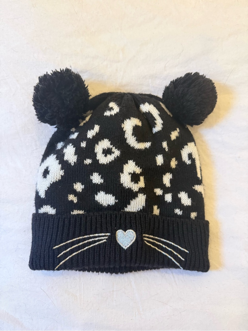 Black & White Leopard Pom Pom Beanie with Heart Detail